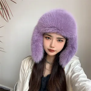 Detailed view of a trendy purple faux fur trapper hat worn by a model for winter warmth
