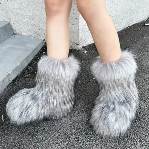 Close-up of ultra-fluffy faux raccoon fur Y2K style snow boots in grey and white tones