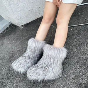 Detailed view of gray faux fur snow boots with fluffy texture for Y2K fashion winter wear