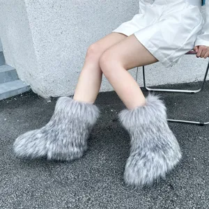 Close-up of fluffy faux fur snow boots in y2k style with a grey spotted pattern design
