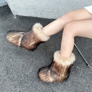 Close-up of stylish and fluffy brown faux raccoon fur Y2K snow boots for winter