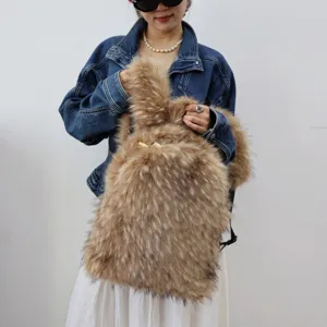 Close-up view of a fluffy faux raccoon fur backpack styled on a model with denim jacket