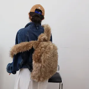 Detail shot of the plush faux raccoon fur texture on a Y2K style fashion backpack