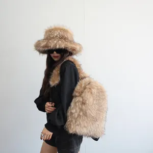 Full view of the stylish faux raccoon fur backpack and matching hat on a model