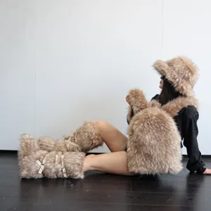 Model showcasing a large faux raccoon fur backpack with matching Y2K style hat and leg warmers