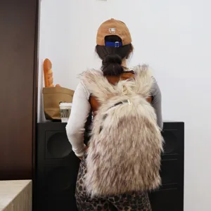 Back view of a large Y2K fashion faux raccoon fur backpack styled with casual daily streetwear