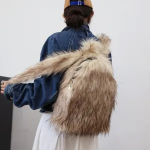 Model wearing a large Y2K faux raccoon fur backpack with shaggy brown texture and gold zipper