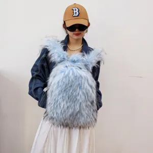Close-up of a fluffy light blue faux raccoon fur Y2K style backpack worn by a model
