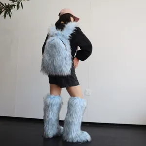 Back view of model wearing light blue faux fur Y2K backpack and matching leg warmers