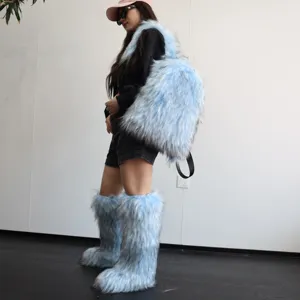 Y2K fashion light blue faux raccoon fur backpack and matching fluffy boots on model