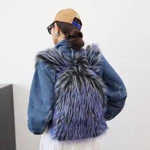 Back view detail of a stylish blue faux raccoon fur backpack worn with denim jacket