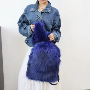 Close-up of vibrant royal blue faux raccoon fur backpack with long plush texture