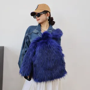 Vibrant blue faux fur backpack in Y2K style worn by a model in a denim jacket for detail