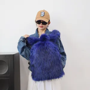 Vibrant blue faux fur backpack worn by a model to showcase the trendy Y2K fashion style