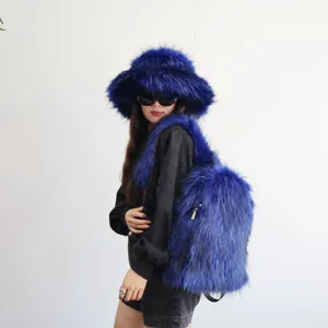 Stylish blue faux raccoon fur backpack and matching fluffy hat worn by model, Y2K fashion