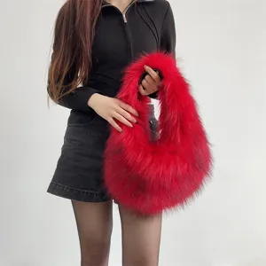 Close-up detail of a bright red faux raccoon fur handbag held by a model in Y2K fashion style