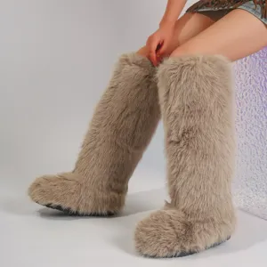 Detailed view of women's khaki faux fur knee-high snow boots featuring a Y2K aesthetic style