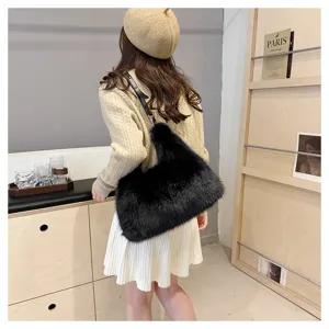 Detailed view of elegant black faux fox fur tote bag styled with a beige winter outfit