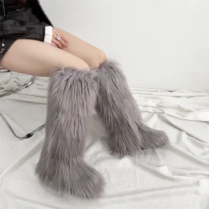 Close-up detail of luxurious grey faux fur on these stylish women's knee-high snow boots