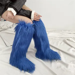 Detail view showing the long, vibrant blue faux fur texture of the knee-high boots.