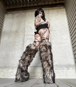Stylish Y2K knee-high faux fur snow boots featuring fluffy texture and thick platform soles