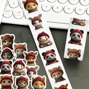 Close-up detail of cute fluffy animal stickers roll featuring adorable cats and pandas.