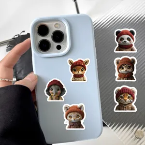 Cute animal stickers detail view showing adorable knit hat designs on phone case decor.