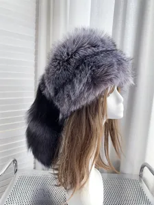 Professional detailed side view of silver fox fur hat with long tail on mannequin head