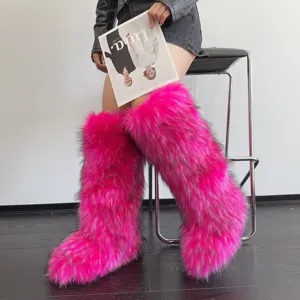 Macro view of the fluffy neon pink faux fur texture on these trendy Y2K knee-high boots
