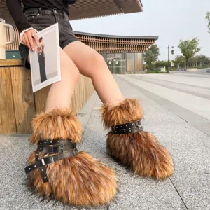 Chic Y2K punk style faux fur snow boots with black rivet leather straps shown on model