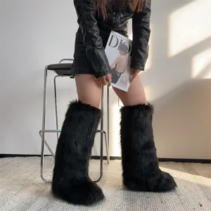 Macro detail showing fluffy black faux fur boots styled with a black leather jacket