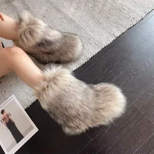 Detailed view of grey faux fur Y2K platform snow boots featuring a fluffy texture
