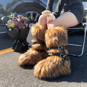 Close-up of Y2K punk faux fur snow boots with leather straps and rivets