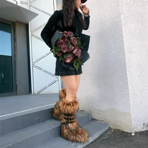 Detailed view of Y2K punk faux fur platform boots with studded straps on a model