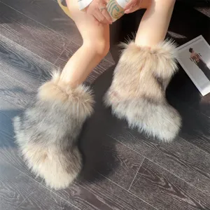 Fashionable styling shot of fluffy Y2K punk faux fur snow boots on dark wooden floor