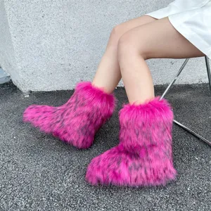 Hot pink faux fur snow boots with fluffy Y2K style texture worn outdoors
