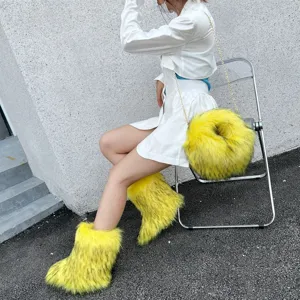 Close-up of fluffy yellow faux fur snow boots and matching chain bag set in Y2K style