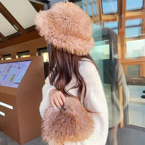 Detail of a fuzzy gradient faux fur bucket hat and matching lunch box handbag set