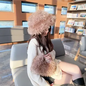 Detail of a women's fluffy faux Mongolian sheep wool hat and matching plush handbag set