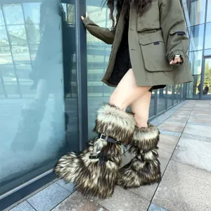 Close-up of Y2K style faux fur snow boots featuring platform soles and buckle straps.