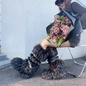 Detail view of Y2K punk style faux fur boots with rivet straps and platform sole