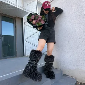 Y2K punk style black faux fur platform boots with rivet strap details worn by a model