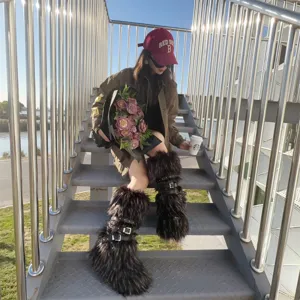 Asian model wearing trendy Y2K punk style black faux fur boots with buckle straps