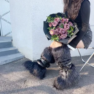 Detail of Y2K punk faux fur boots with buckle straps and rivet accents