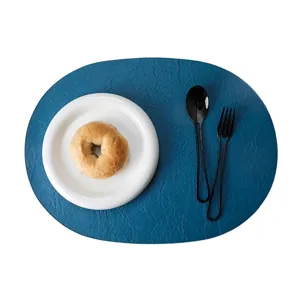 Tovaglietta ovale in pelle blu di lusso con finitura testurizzata per tavolo da pranzo