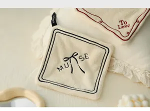 Close-up of double-layer thickened hand towel with Muse bow embroidery