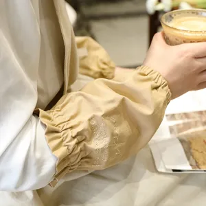 Coprimaniche in cotone minimalisti con ricamo beige per ufficio e uso domestico.