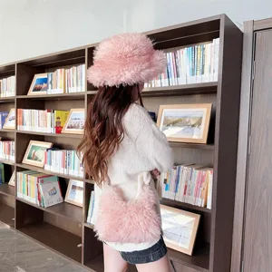 Pink fuzzy bucket hat and matching plush handbag set shown in a cozy library setting.