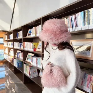 Woman wearing pink faux fur bucket hat and matching plush handbag in a library setting