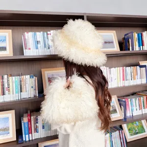 Detail view of the fuzzy white faux lamb wool bucket hat and matching plush handbag set.